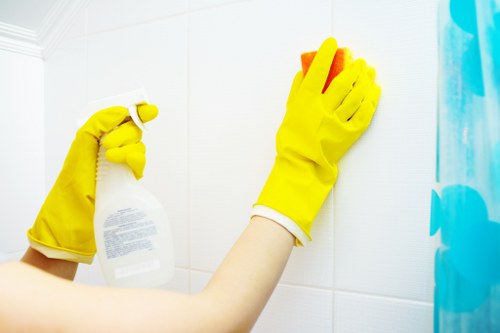 Trained carpet cleaning staff using PPE during a professional service