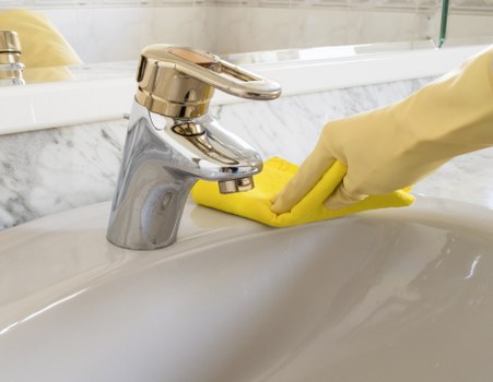 Cleaning products and protective gear arranged for safe carpet cleaning
