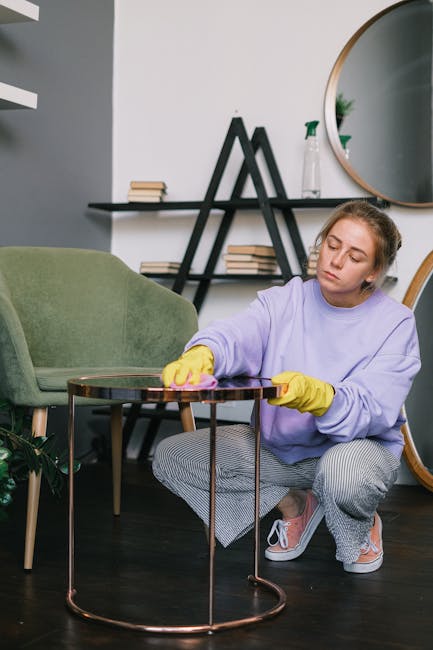 A long, bright blue upholstered bench with a smooth, clean surface is positioned against a plain white wall in a well-lit room. The bench consists of multiple connected sections with a consistent upho
